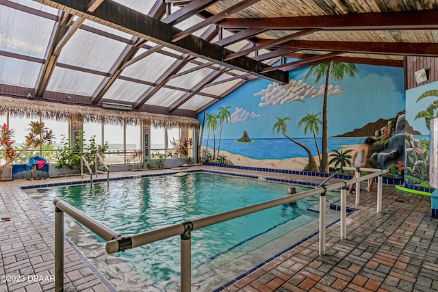 2301 S Atlantic Ave Unit 120, Daytona Beach Shores, FL 32118 - indoor community pool featuring a patio, a water view, and a pergola