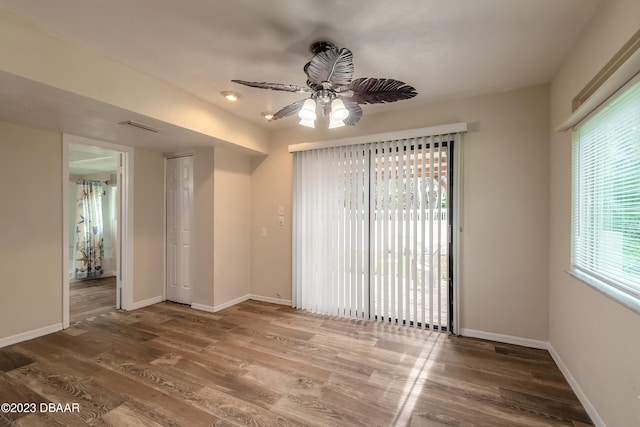 unfurnished room featuring hardwood / wood-style floors and ceiling fan