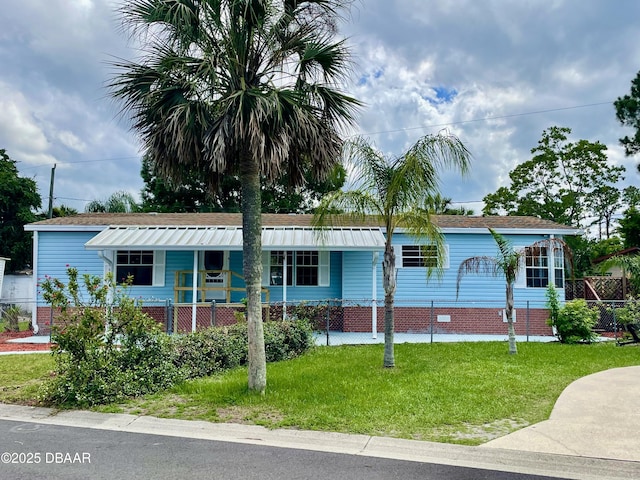 1910 Woodcrest Dr, Ormond Beach, FL 32174 - view of front of home with a front yard and covered porch