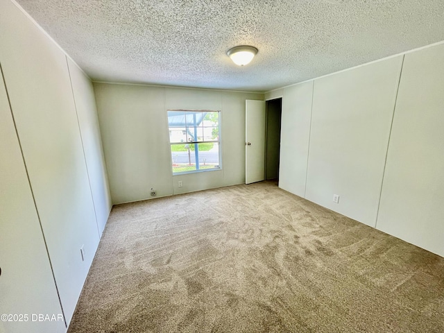 1910 Woodcrest Dr, Ormond Beach, FL 32174 - unfurnished room with carpet floors and a textured ceiling