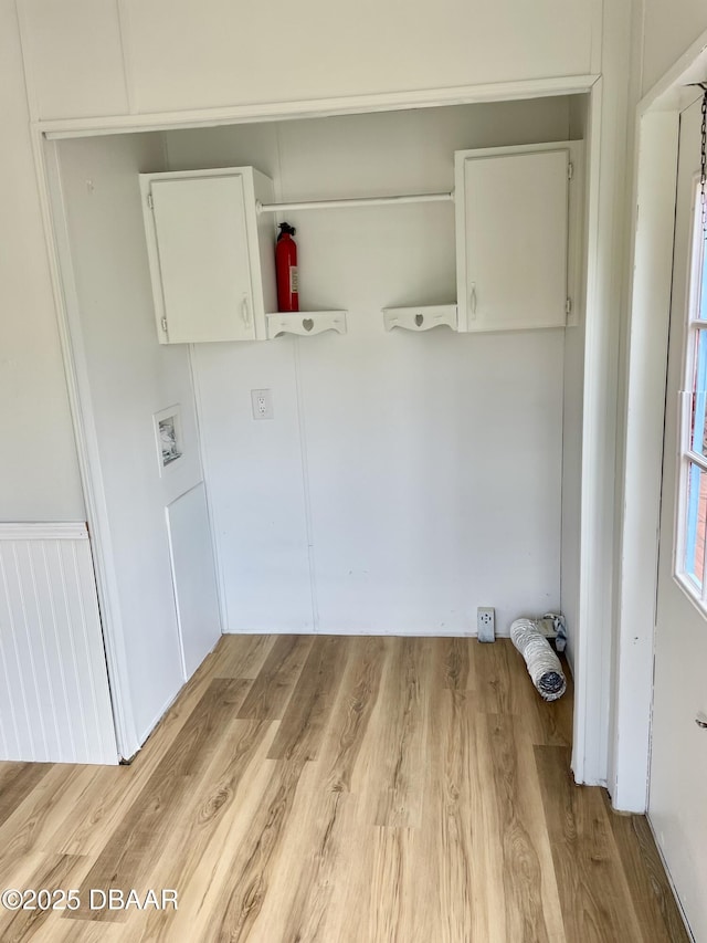 1910 Woodcrest Dr, Ormond Beach, FL 32174 - laundry area with light wood-style flooring
