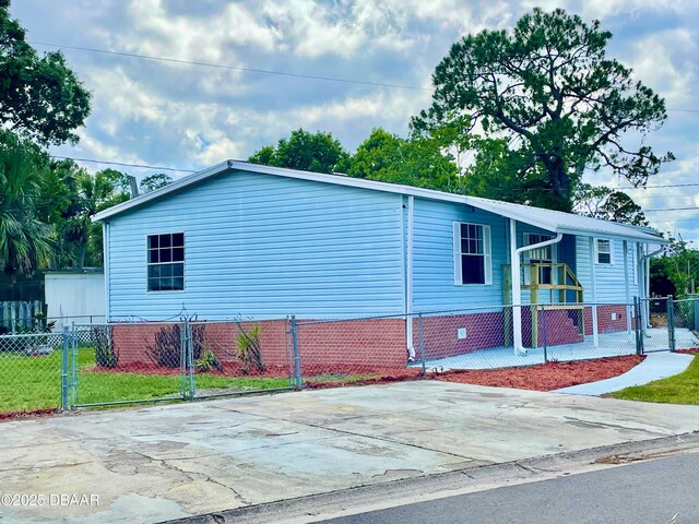 1910 Woodcrest Dr, Ormond Beach, FL 32174 - view of property exterior with a gate
