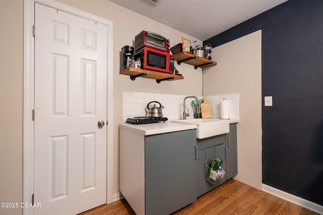 127 Bosarvey Dr, Ormond Beach, FL 32176 - washroom with a sink and light wood finished floors