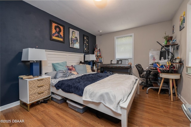 127 Bosarvey Dr, Ormond Beach, FL 32176 - bedroom featuring wood finished floors and a desk