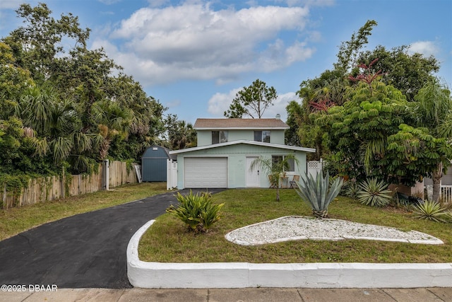 127 Bosarvey Dr, Ormond Beach, FL 32176 - view of front of property with driveway, stucco siding, a shed, and a garage