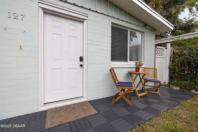 127 Bosarvey Dr, Ormond Beach, FL 32176 - view of exterior entry featuring board and batten siding