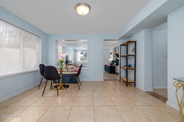 127 Bosarvey Dr, Ormond Beach, FL 32176 - dining area featuring light tile patterned floors and baseboards