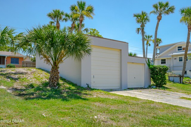 garage featuring a yard