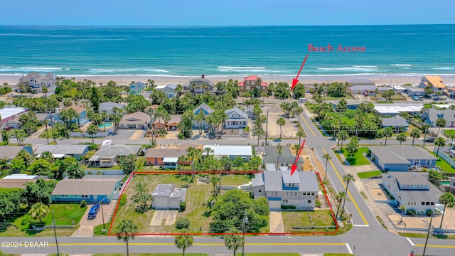 aerial view with a water view and a beach view