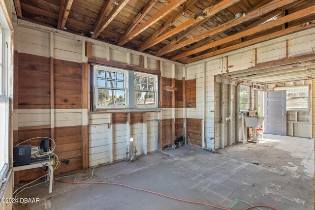 miscellaneous room featuring wooden walls