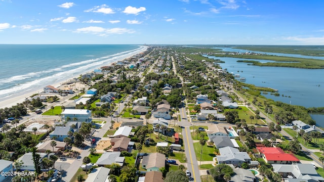 aerial view featuring a view of the beach and a water view