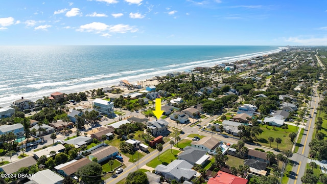 bird's eye view with a water view and a view of the beach