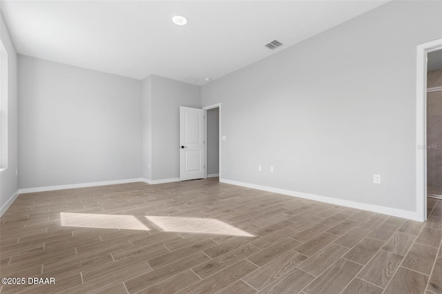 21 Weymouth Ln, Palm Coast, FL 32164 - spare room featuring wood finished floors and baseboards