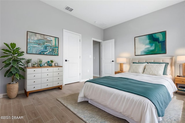 21 Weymouth Ln, Palm Coast, FL 32164 - bedroom with baseboards and wood finished floors