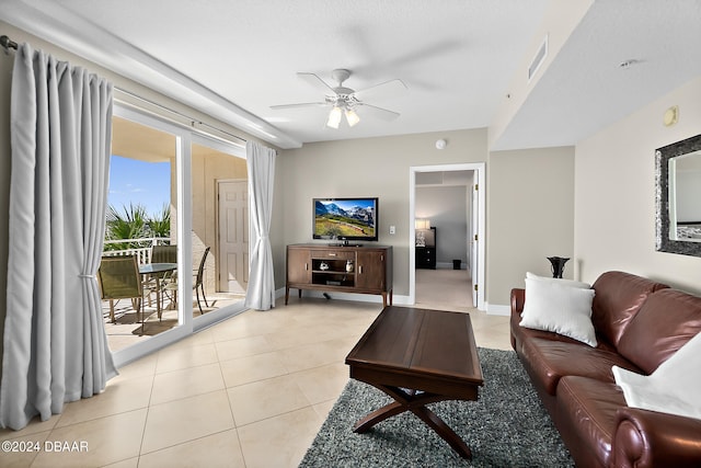 living room featuring ceiling fan and light tile patterned floors