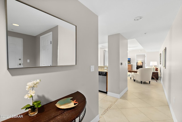 corridor featuring light tile patterned floors