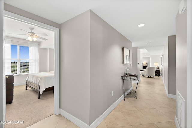 corridor with light tile patterned flooring