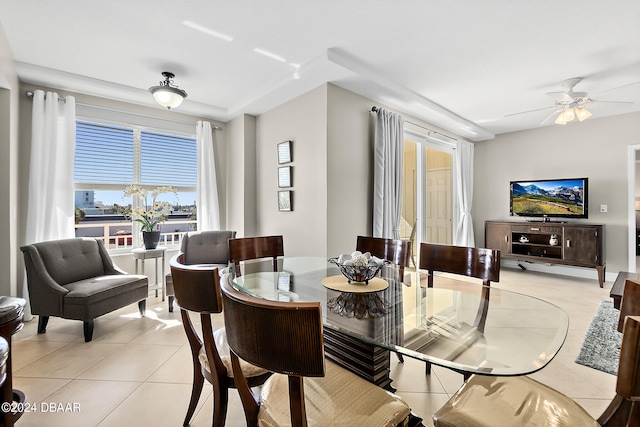 tiled dining space featuring ceiling fan