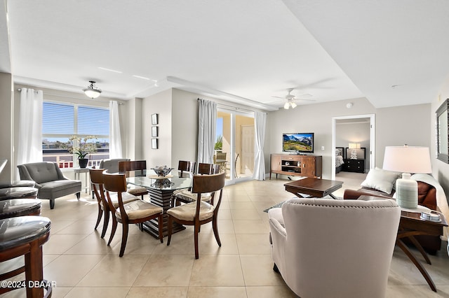 tiled dining area featuring ceiling fan