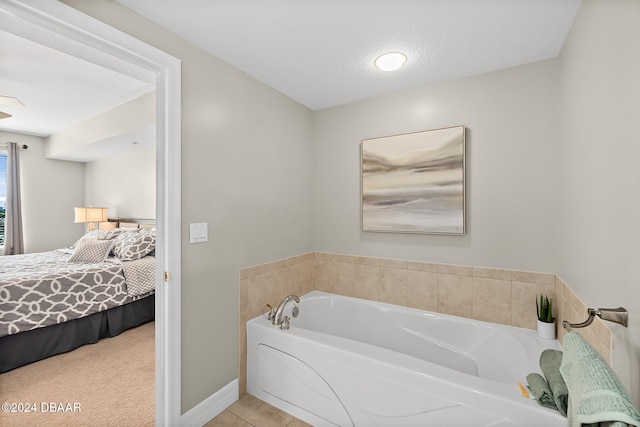 bathroom with a washtub and a textured ceiling