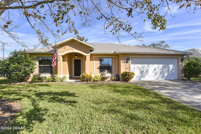 ranch-style home with a front yard and a garage