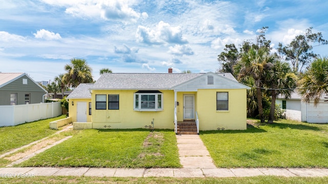 view of front of house with a front lawn