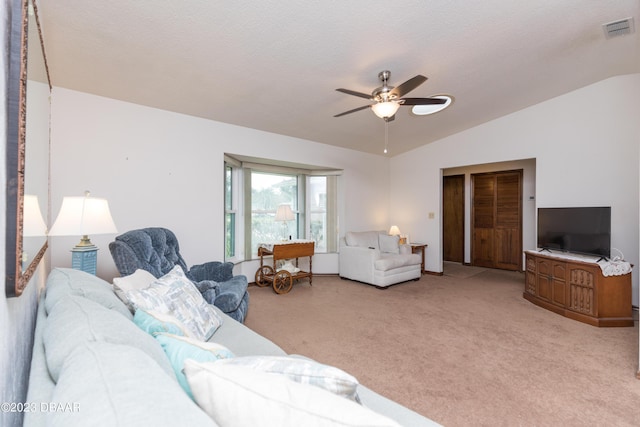 living room featuring light carpet, ceiling fan, and lofted ceiling