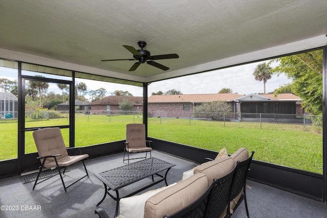 sunroom / solarium with plenty of natural light and ceiling fan