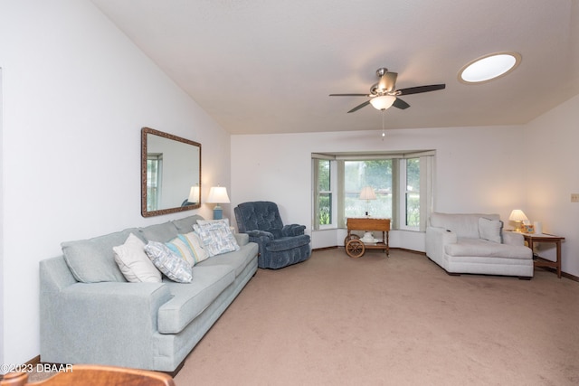 living room featuring carpet floors, vaulted ceiling, and ceiling fan