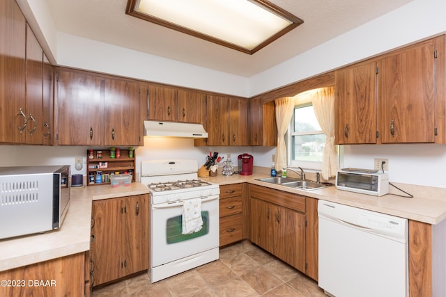 kitchen with sink and white appliances