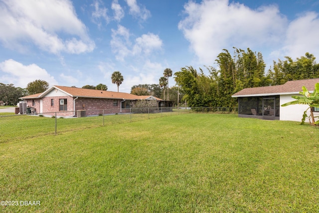 view of yard featuring a sunroom