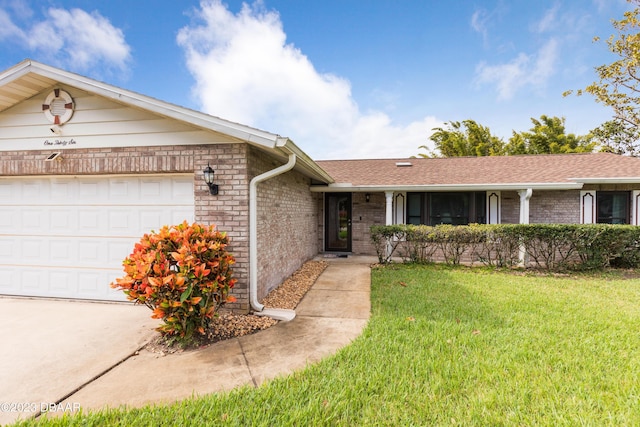 single story home featuring a front yard and a garage