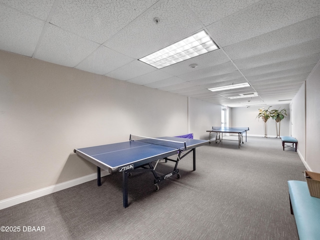 rec room with carpet flooring, baseboards, and a paneled ceiling
