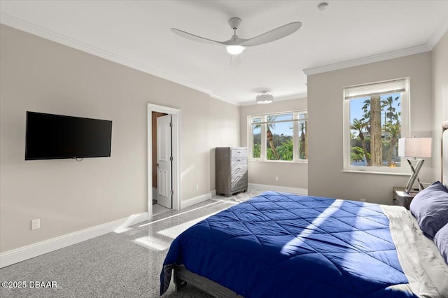 carpeted bedroom featuring ceiling fan, baseboards, and ornamental molding