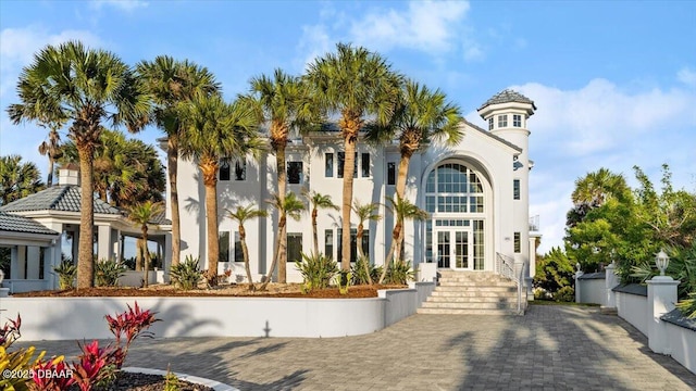 view of front of house featuring french doors and stucco siding