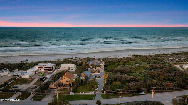 drone / aerial view with a beach view and a water view