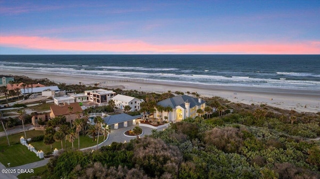 bird's eye view featuring a beach view and a water view