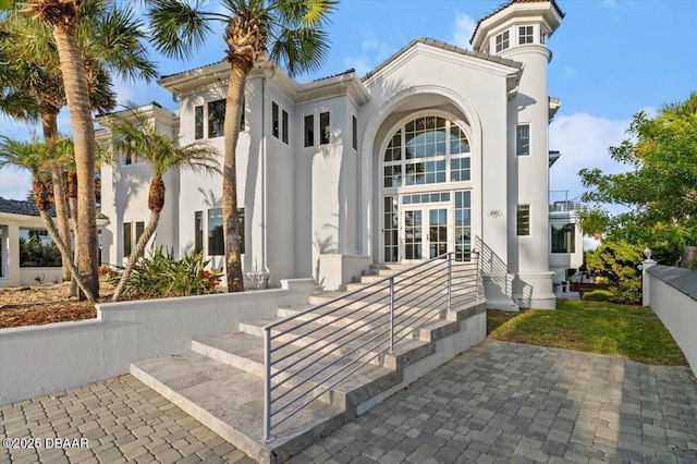 view of front of home featuring stucco siding