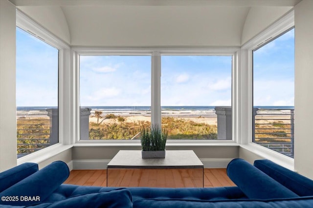 sunroom / solarium with a water view