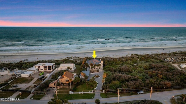 bird's eye view featuring a beach view and a water view