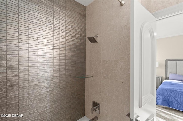 ensuite bathroom featuring a tile shower and ensuite bathroom