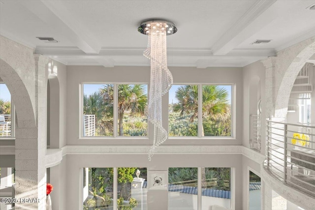 interior details with visible vents, coffered ceiling, beamed ceiling, and ornamental molding