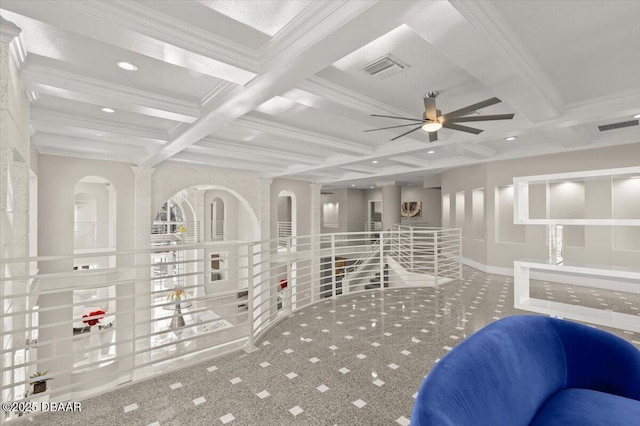 interior space with visible vents, beamed ceiling, coffered ceiling, and crown molding