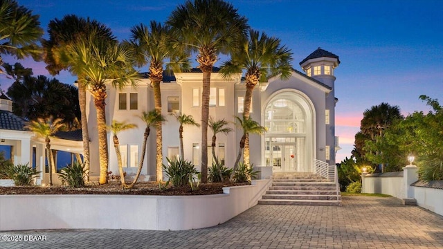 exterior space with stucco siding and french doors