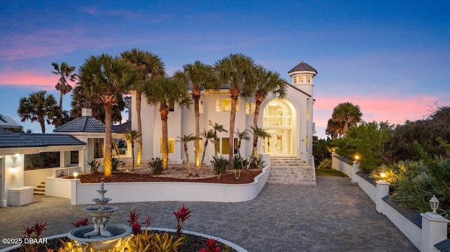 exterior space featuring fence and stucco siding