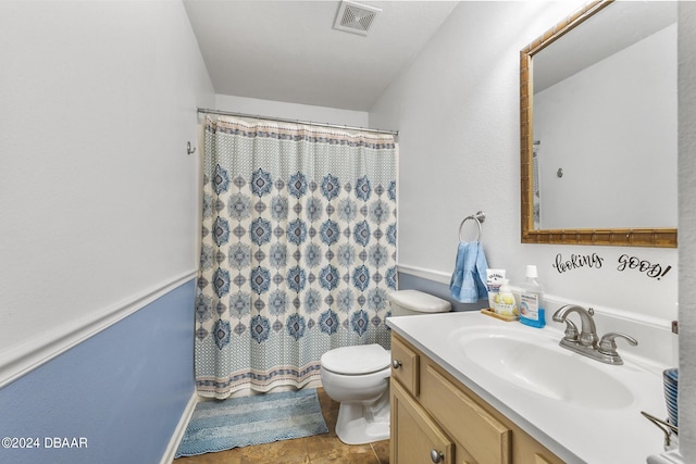 10 Pine Brook Dr, Palm Coast, FL 32164 - bathroom featuring walk in shower, tile patterned flooring, vanity, and toilet
