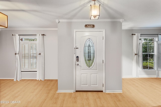 10 Pine Brook Dr, Palm Coast, FL 32164 - foyer entrance with light hardwood / wood-style flooring and ornamental molding