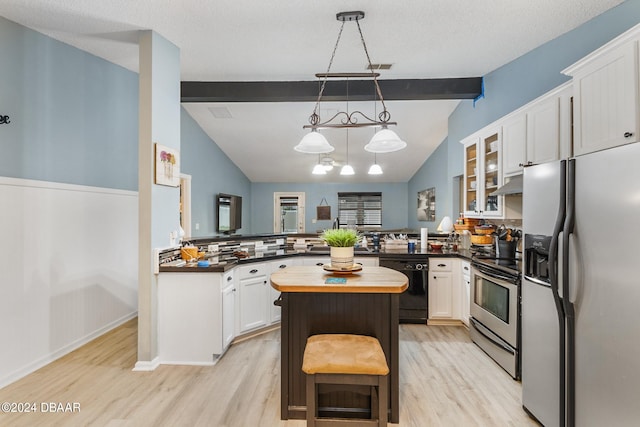 10 Pine Brook Dr, Palm Coast, FL 32164 - kitchen featuring stainless steel appliances, light hardwood / wood-style floors, kitchen peninsula, white cabinetry, and decorative light fixtures