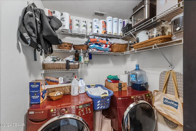 10 Pine Brook Dr, Palm Coast, FL 32164 - laundry area with a textured ceiling and washer and clothes dryer