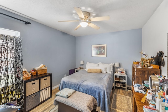10 Pine Brook Dr, Palm Coast, FL 32164 - bedroom featuring light hardwood / wood-style floors, a textured ceiling, and ceiling fan